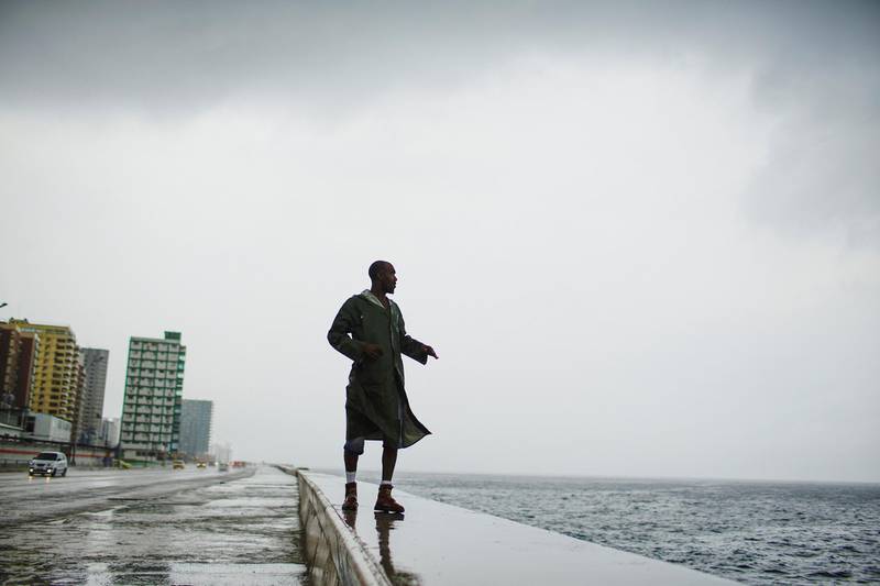 Alexander Charnicharo fishes at the seafront in Havana as Hurricane Michael passes by western Cuba. Reuters