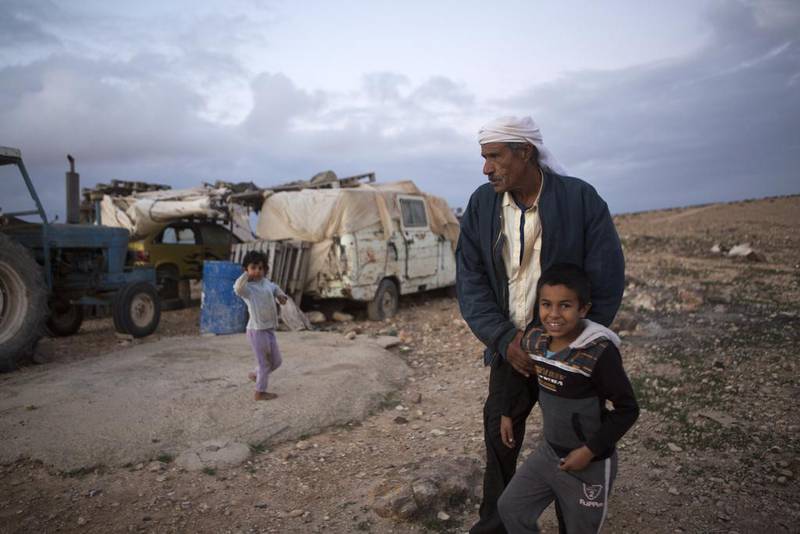 Salameh Gwineh, 64, with his children near his home in the village of Qatamat located in the Negev Desert south of Israeli city of Beersheba. The Israeli government has plans to build a Jewish community called Daya but Gwineh says, ‘I want to stay where I live , this is my place.’