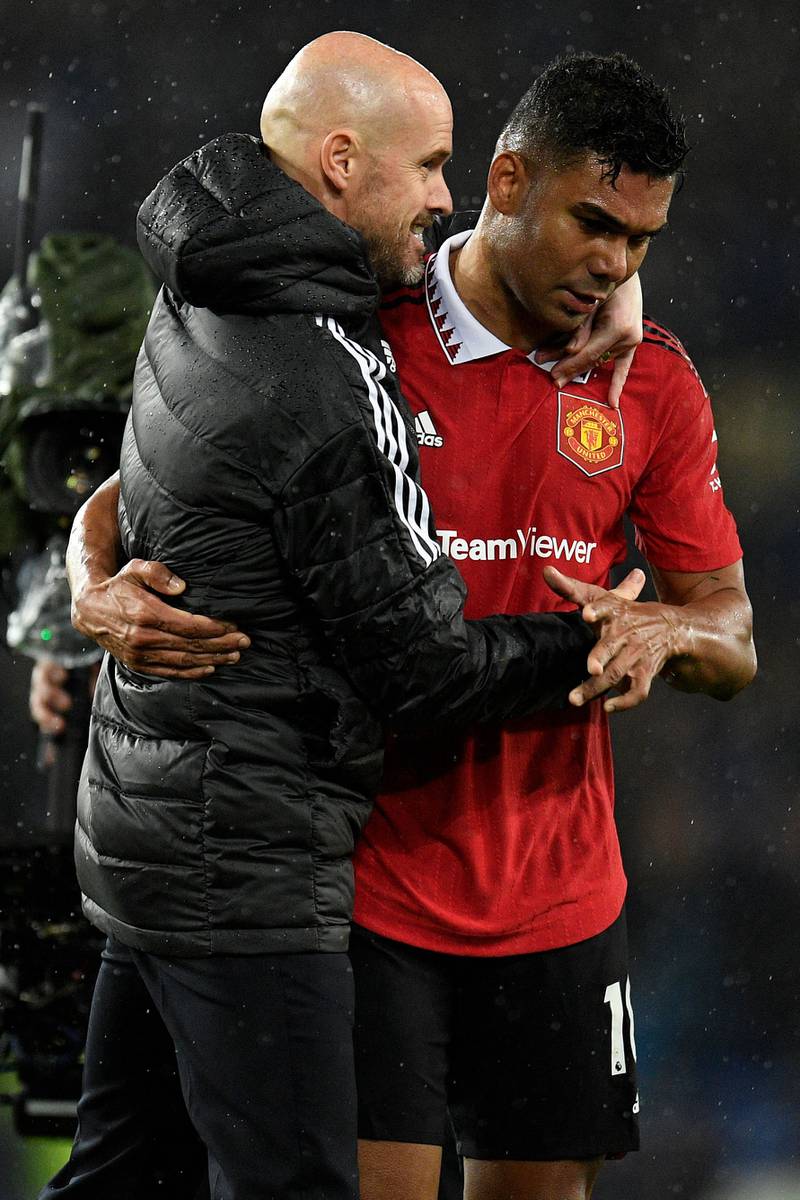 Manchester United manager Erik ten Hag and Casemiro (R) after the final whistle. AFP