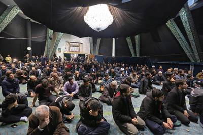 Students attend a memorial for the victims of the Ukraine plane crash, in University of Tehran. AFP