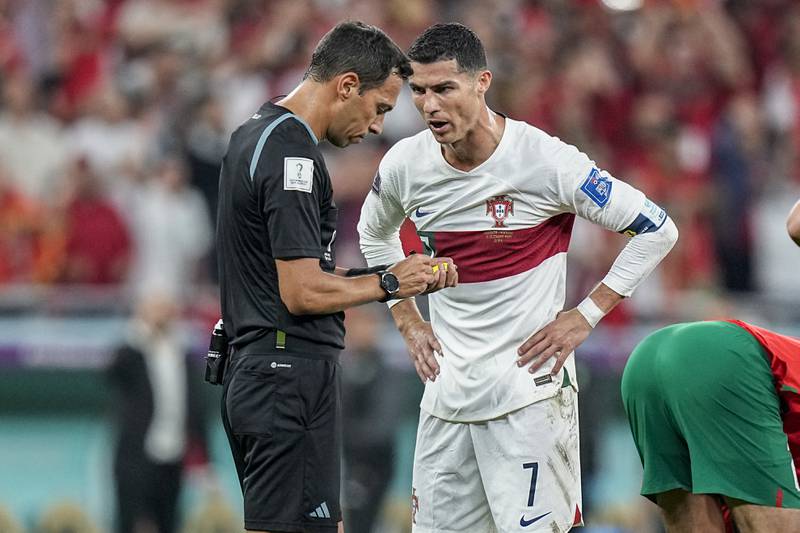 Portugal's Cristiano Ronaldo talks with the referee Facundo Tello. AP