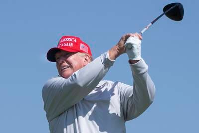 Former US president Donald Trump tees off during the pro-am tournament of the 2023 LIV Golf DC at Trump National Golf Club in Sterling, Virginia. EPA