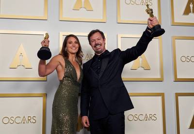 Best Documentary Feature: Pippa Ehrlich and James Reed, for 'My Octopus Teacher', pose in the press room at the Oscars on Sunday, April 25, 2021, at Union Station in Los Angeles. AP Photo