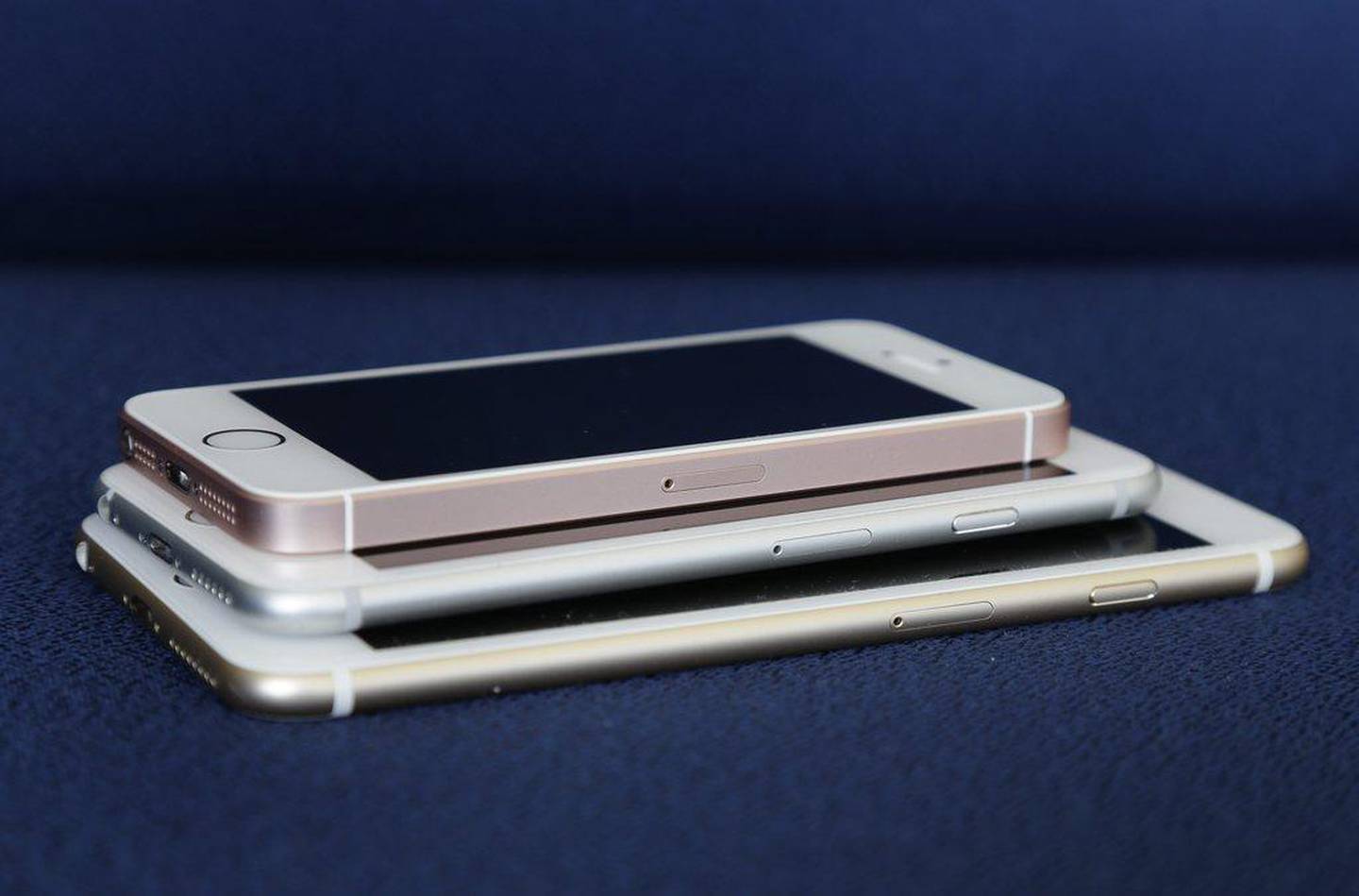 From bottom, the iPhone 6s Plus, 6s and SE lie stacked on one another. Apple stopped making the SE in 2018. AP Photo