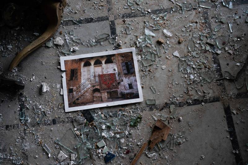 A photo rests among broken glass on the floor of the Sursock Palace. AP Photo