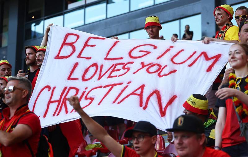 Belgium's supporters hold a banner in support of Denmark's midfielder Christian Eriksen. AFP