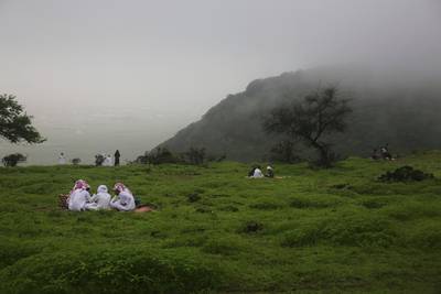 Picnickers on Jebal Ayoub, north of Salalah, Oman. The foggy monsoon season draws thousands of visitors seeking relief from high temperatures elsewhere in the GCC.