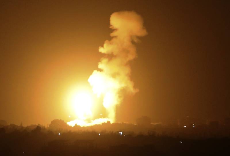 A fireball rises following an air strike in Khan Yunis in the southern Gaza Strip. Said Khatib / AFP