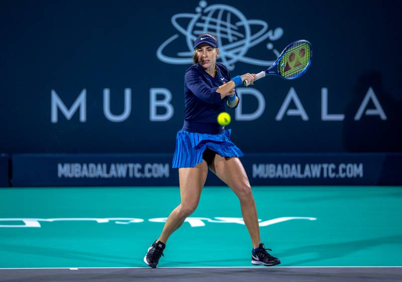Belinda Bencic hits a forehand to Ons Jabeur during the Mubadala World Tennis Championship at the International Tennis Centre, Zayed Sports City, Abu Dhabi on December 16, 2021. Victor Besa / The National