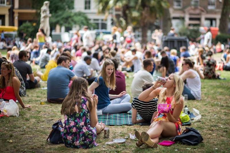 People enjoying the sun in Soho Square on July 1, 2015 in London, England.  Rob Stothard/Getty Images