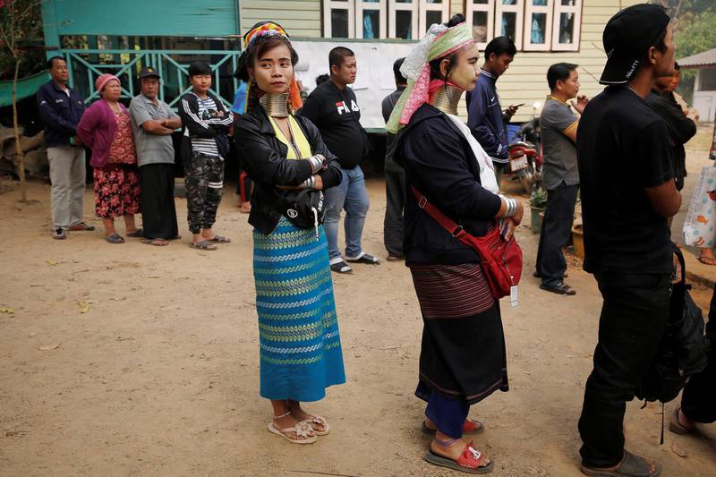 Ethnic Kayan arrive at a polling station in Ban Huadua school to cast their vote in Mae Hong Son. Reuters