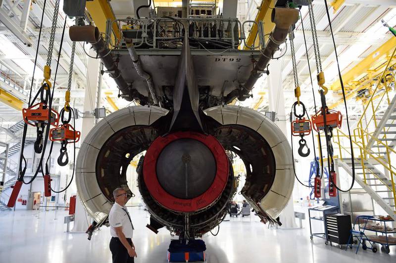 An employee inspecting  a jet engine at the Rolls-Royce's Mechanical Testing Operations Centre. Rolls slumped into a record annual net loss for 2016.

 Odd Andersen / AFP 

