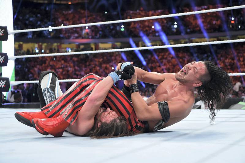 Shinsuke Nakamura tries to put a submission move on AJ Styles at the WWE Greatest Royal Rumble in Jeddah, Saudi Arabia. Courtesy WWE
