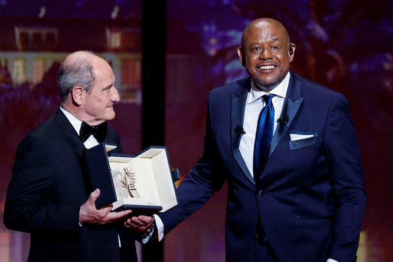 Forest Whitaker, right, receives the Honorary Palme d’Or Award from Cannes Film Festival president Pierre Lescure. Reuters