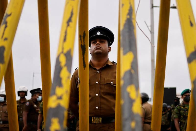 Security personnel stand guard after a raid on an anti-government protest camp in Colombo early on Friday, amid Sri Lanka's economic crisis. Reuters