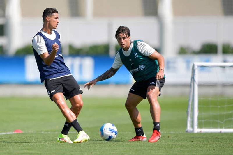 Cristiano Ronaldo and Luca Pellegrini during a training session.