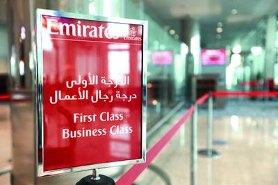 A sign for the Emirates airlines first and business class is seen inside terminal 3 at concourse A, the new A380 terminal at Dubai International Airport in Dubai, United Arab Emirates, on Monday, Feb. 25, 2013. Dedicated for use by Emirates Airline the terminal 3 complex includes an associated airside facility known as Concourse B and a purpose-built facility for Airbus A380 known as Concourse A. Photographer: Gabriela Maj/Bloomberg 
