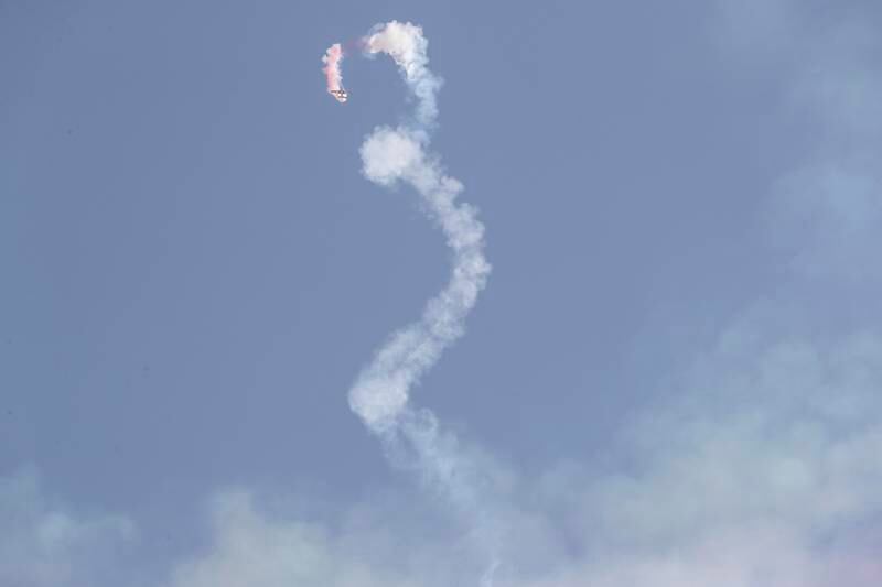 A jet leaves a corkscrew smoke trail above Expo. Antonie Robertson / The National