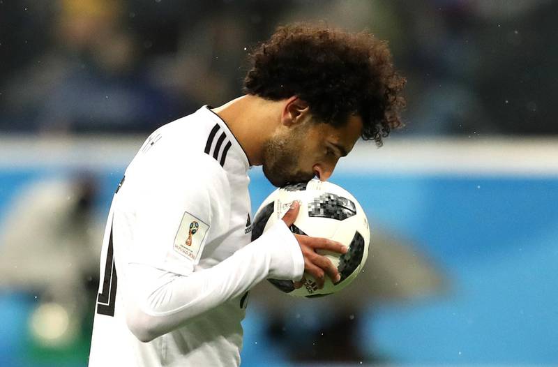 Mohamed Salah of Egypt kisses the ball before scoring from the penalty spot during the 2018 FIFA World Cup Russia group A match between Russia and Egypt at Saint Petersburg Stadium. Francois Nel / Getty Images