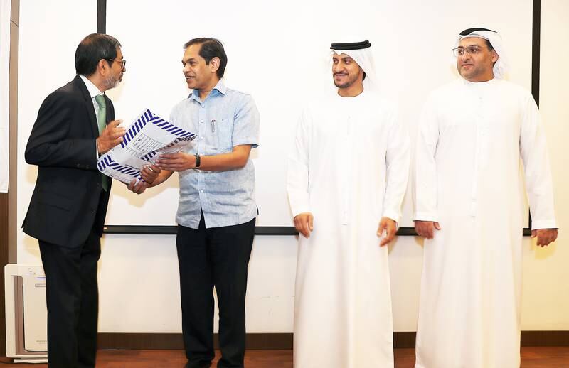 Sunjay Sudhir, Indian Ambassador to the UAE (2nd from left); Juma Mohammed Al Kait, Assistant Undersecretary, Foreign Trade Affairs, Ministry Of Economy (3rd from left); Suoud Al Aqroubi, Director of International Co-operation, Federal Customs Authority (1st from right); and Indian businessman KP Salam, vice chairman of Malabar Gold & Diamonds (1st left). Pawan Singh / The National