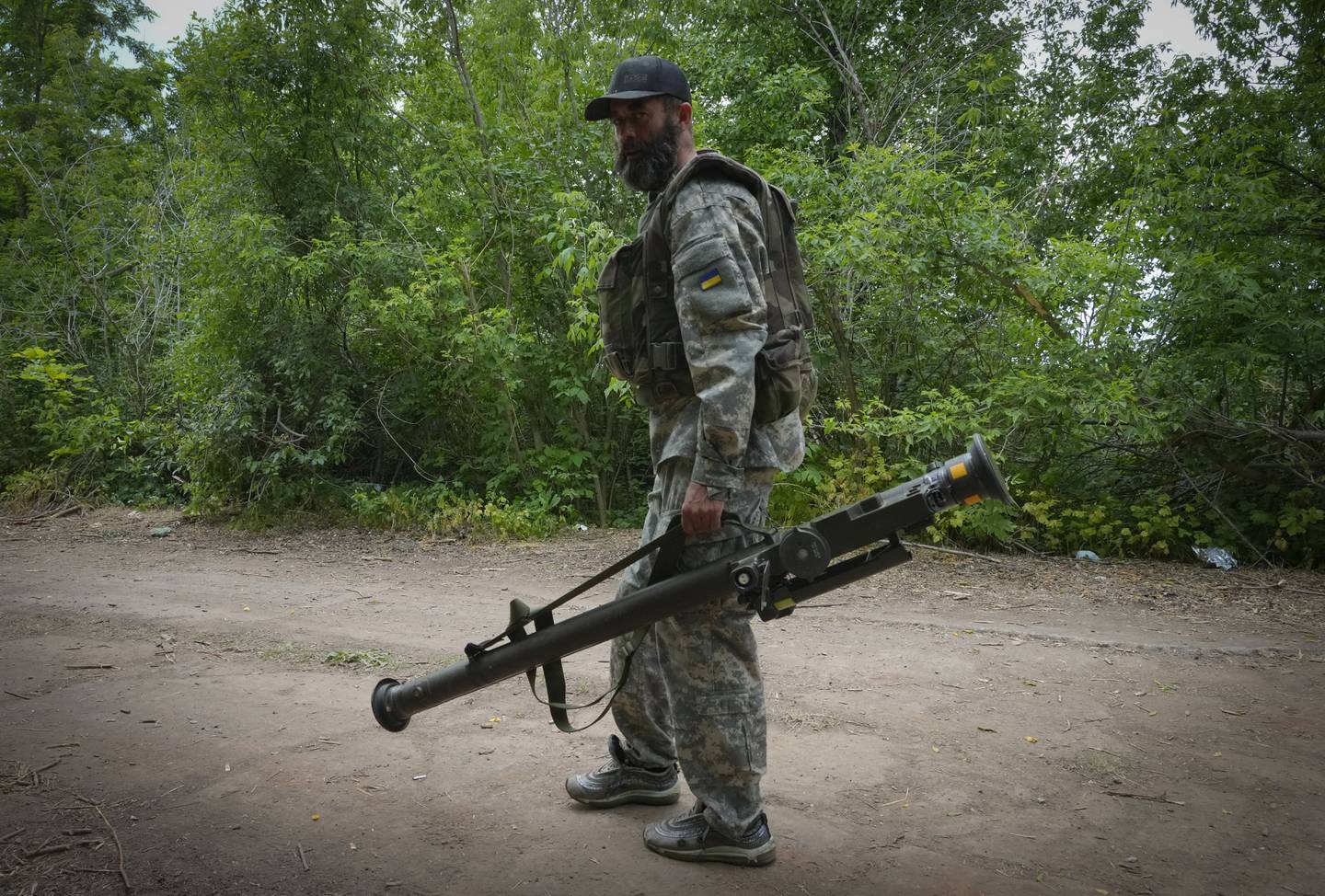 A Ukrainian soldier carries a US-supplied Stinger missile in the eastern Donetsk region. AP