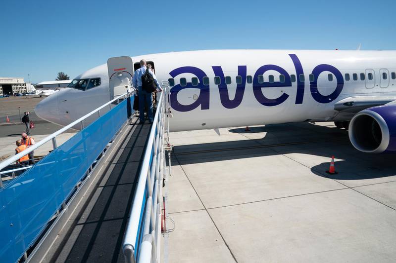 Passengers board an Avelo Airlines flight. Bloomberg
