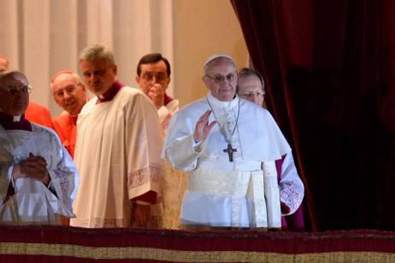 New Pope, Argentinian cardinal Jorge Mario Bergoglio appears at the window of St Peter's Basilica's balcony after being elected the 266th pope of the Roman Catholic Church on March 13, 2013 at the Vatican.  AFP PHOTO / FILIPPO MONTEFORTE
 *** Local Caption ***  684330-01-08.jpg