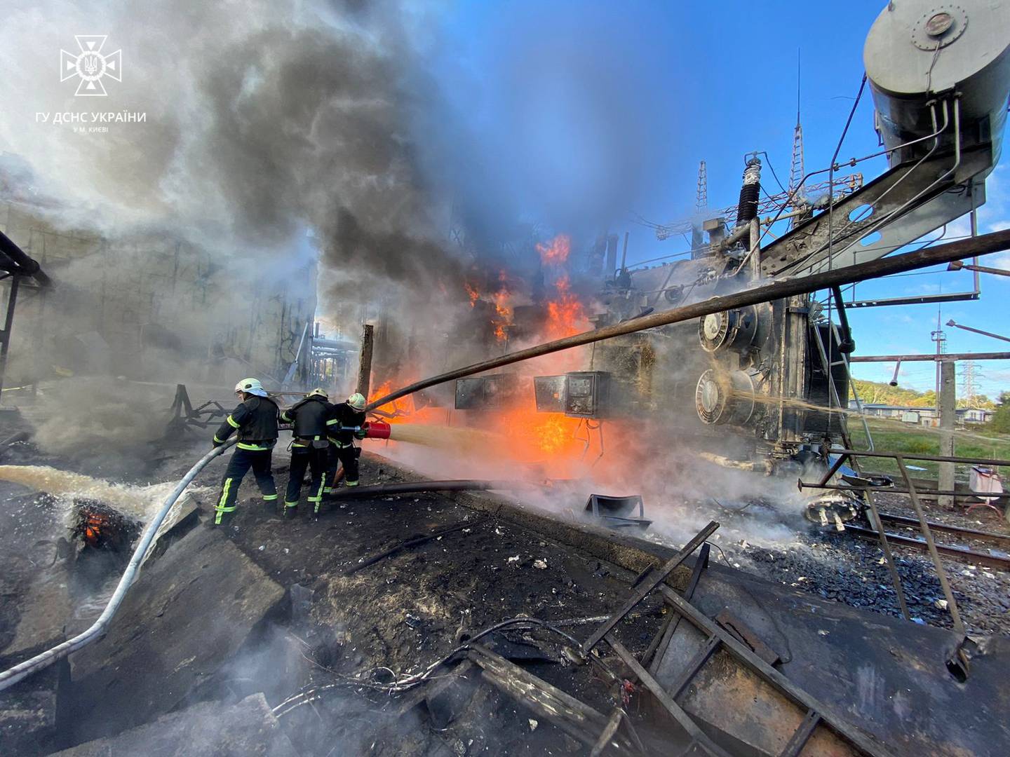 Firefighters battle a blaze after a Russian cruise missile hit infrastructure in Kyiv on Monday. Reuters
