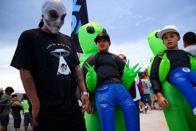 People in costume after the Abduction Parade during the UFO Festival in Roswell. AFP