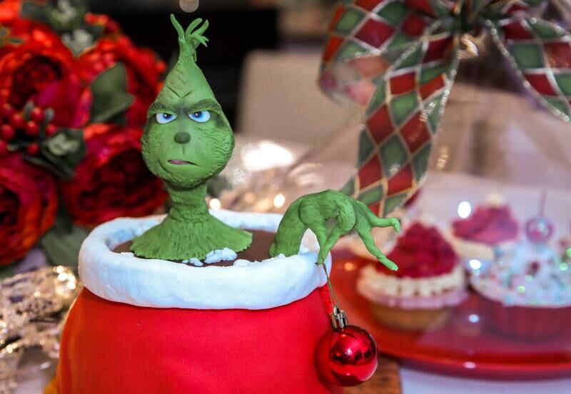 A Grinch decoration on the dining table