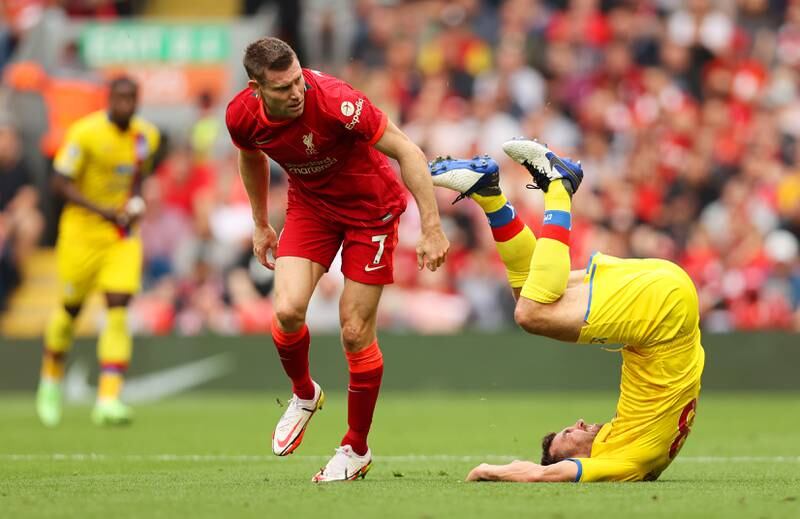 Crystal Palace midfielder James McArthur takes a tumble after a challenge by Liverpool midfielder James Milner. Getty Images