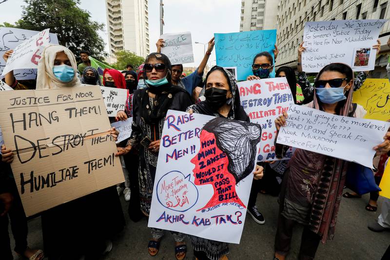 People carry signs against the killing of Noor Mukadam, 27, daughter of former Pakistani diplomat, and to condemn the violence against women and girls during a protest in Karachi, Pakistan. Reuters