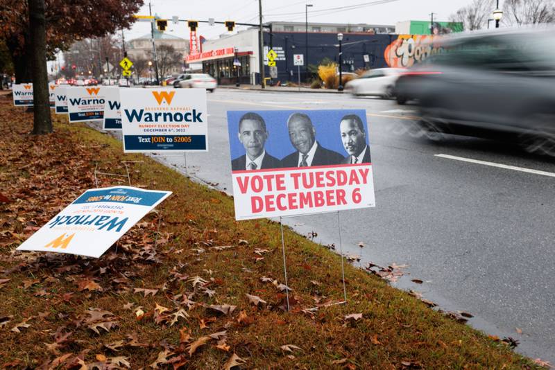 Signs depicting former US president Barack Obama, the late representative John Lewis  and Martin Luther King Jr were seen throughout Atlanta encouraging people to vote in the runoff. Bloomberg