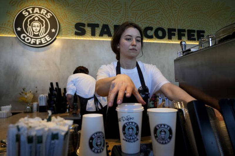 Workers of the Stars Coffee are seen after former Starbucks coffee shops are reopened as Stars Coffee in Moscow, Russia. Anadolu Agency via Getty Images