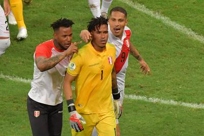 Peru goalkeeper Pedro Gallese and teammates celebrate the penalty shootout win over Uruguay. AFP