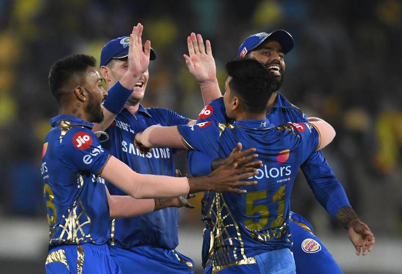 Mumbai Indians cricketers celebrate taking the wicket of Chennai Super Kings captain Mahendra Singh Dhoni during the 2019 Indian Premier League (IPL) Twenty20 final cricket match between Mumbai Indians and Chennai Super Kings at the Rajiv Gandhi International Cricket Stadium in Hyderabad on May 12, 2019. (Photo by NOAH SEELAM / AFP) / ----IMAGE RESTRICTED TO EDITORIAL USE - STRICTLY NO COMMERCIAL USE-----