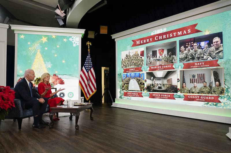 President Joe Biden and first lady Jill Biden hold a virtual Christmas meeting with servicemen and women around the world, at the White House. AP Photo