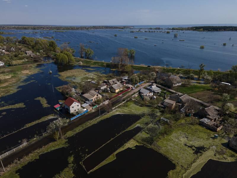 Flooded gardens and fields are shown in Demydiv, Ukraine. To keep Russian armoured columns at bay, Ukrainian forces released water from a nearby hydroelectric dam to intentionally flood Demydiv, a village north of Kyiv. The decision was effective, but efforts to drain the area are complicated. Getty Images