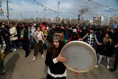 A daf drum is played to accompany the Halay folk dance as Turkish Kurds celebrate Nowruz in Diyarbakir, southeastern Turkey. AFP