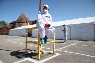 Workers wearing protective equipment are seen on the grounds of the Central Jamia Mosque Ghamkol Sharif, a temporary morgue set up at a Mosque as the spread of the Coronavirus disease (Covid-19) continues, Birmingham, Britain. REUTERS