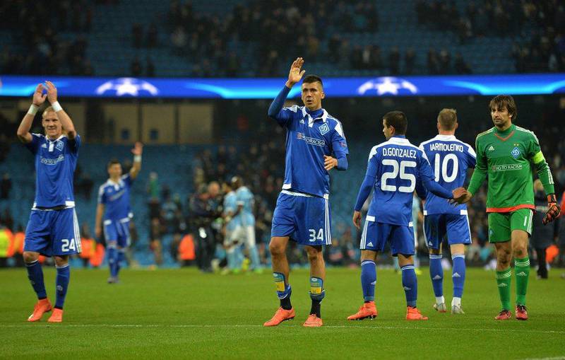 Dynamo Kiev's Ukrainian defender Yevhen Khacheridi, centre, waves to the fans following their Uefa Champions League last 16, second leg match against Manchester City at the Etihad Stadium in Manchester, north west England, on March 15, 2016. The match ended in a draw. AFP / PAUL ELLIS 