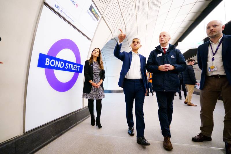 London mayor Sadiq Khan, second left, during a tour of the new station. PA