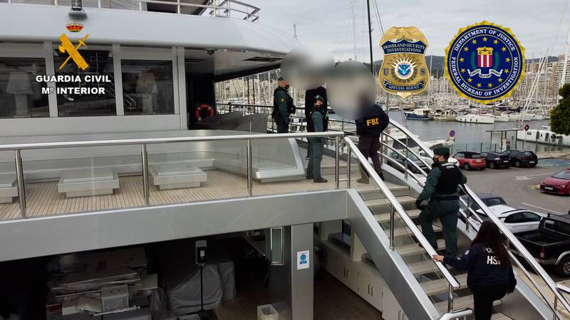 Spanish civil guards and US agents of Homeland Security and the FBI search a yacht owned by Russian billionaire Viktor Vekselberg in Palma de Mallorca, Spain. AFP