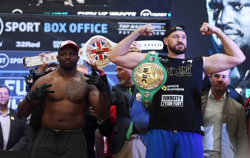Tyson Fury and Dillian Whyte pose during the weigh-in. EPA
