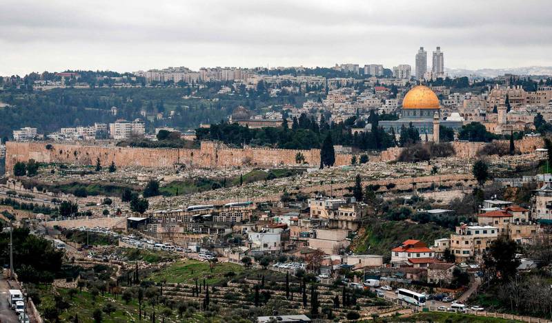 This picture taken on February 10, 2020 shows a view of the Dome of the Rock (R) and al-Aqsa mosque (C), both within the area known as al-Aqsa mosque compound to Muslims and the Temple Mount to Jews, in Jerusalem on a stormy day.  / AFP / AHMAD GHARABLI
