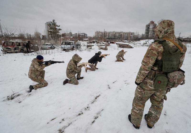 A veteran of the Ukrainian National Guard conducts military exercises for civilians in Kiev. Reuters