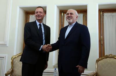 France's top diplomat Emmanuel Bonne shakes hands with Iran's Foreign Minister Mohammad Javad Zarif in Tehran, Iran July 10, 2019.  Nazanin Tabatabaee/WANA (West Asia News Agency) via REUTERS. ATTENTION EDITORS - THIS IMAGE HAS BEEN SUPPLIED BY A THIRD PARTY.