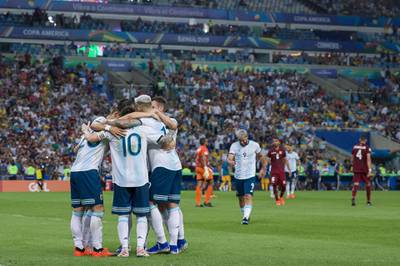 Argentina players celebrate with Giovani Lo Celso after he scored their second goal. Getty Images