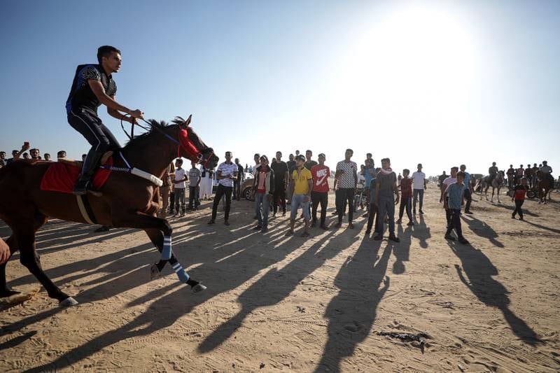 A Palestinian rides a horse during a race on the grounds of the defunct Yasser Arafat Airport in eastern Rafah, southern Gaza Strip. EPA 