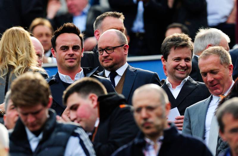 NEWCASTLE UPON TYNE, ENGLAND - MAY 19: Newcastle fans Ant McPartlin and Declan Donnelly look on during the Barclays Premier League match between Newcastle United and Arsenal at St James' Park on May 19, 2013 in Newcastle upon Tyne, England. (Photo by Stu Forster/Getty Images)